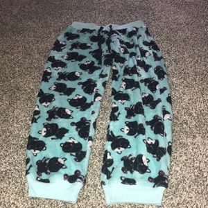 Blue fuzzy pajama pants with black cats